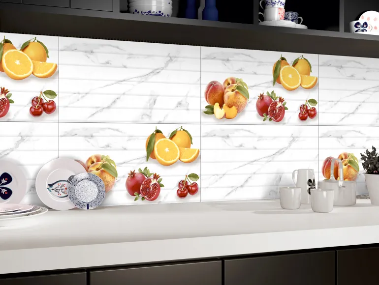 Contemporary white kitchen design featuring white marble-patterned tiles with colorful fruit designs